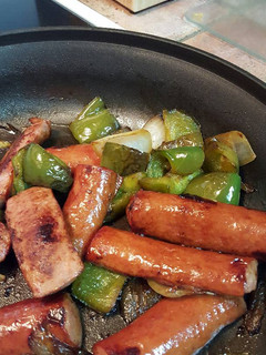 A picture of Sausage, peppers, and onions.