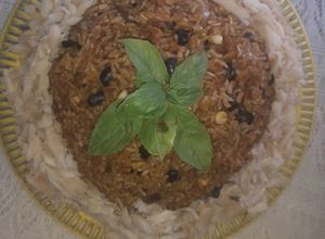 Una foto de Arroz de curvina salada con frijoles negros y maiz tierno