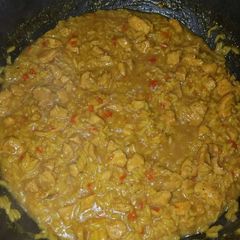 A picture of Chicken and yellow rice.