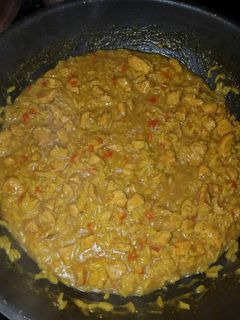 A picture of Chicken and yellow rice.