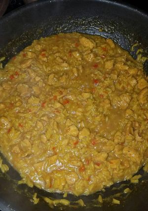 A picture of Chicken and yellow rice.
