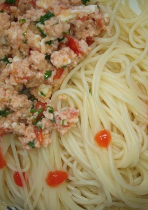 A picture of Spaghetti served with scrambled eggs.