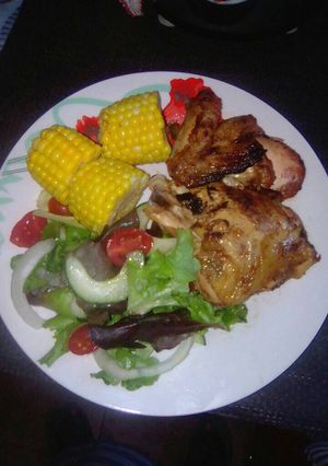 A picture of Fried chicken with veggies.