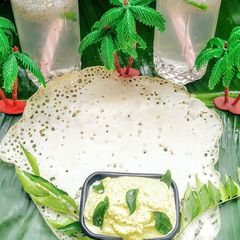 A picture of Appam with coconut chutney.