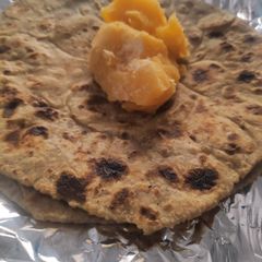 A picture of Bajre ki Roti and Gud.