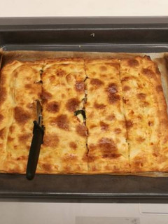 Una foto de Coca de espinacas y feta