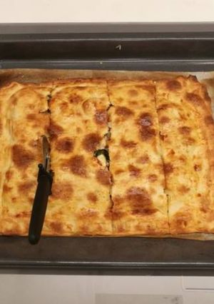 Una foto de Coca de espinacas y feta