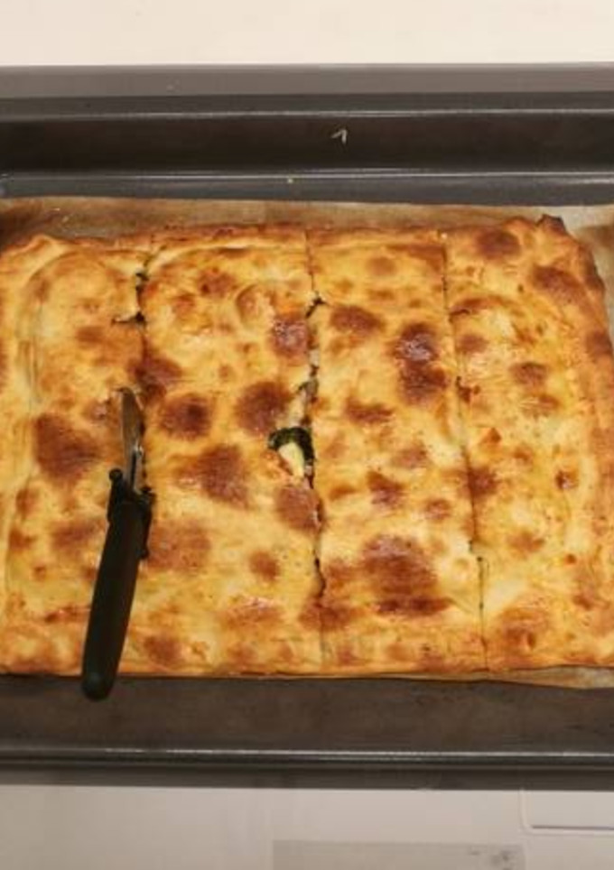 Una foto de Coca de espinacas y feta