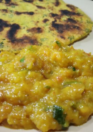 A picture of Turnip saag with makki roti.