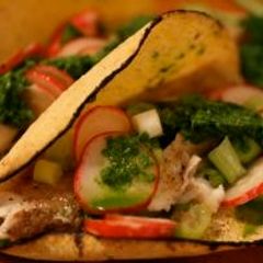 A picture of Fish Tacos with Salsa Verde and Radish Salad.