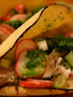 A picture of Fish Tacos with Salsa Verde and Radish Salad.