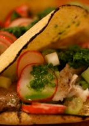 A picture of Fish Tacos with Salsa Verde and Radish Salad.