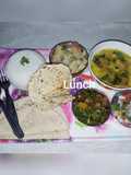 Fry dal masala bhindi boiled rice potato Chokha salad papad