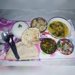 A picture of Fry dal masala bhindi boiled rice potato Chokha salad papad.