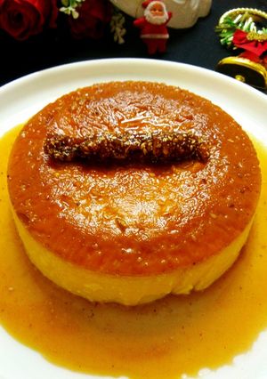 A picture of Christmas special eggless caramel custard pudding cake with dry fruit chikki log.