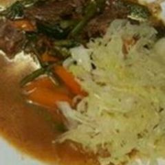 A picture of Stewed beef with Steamed Cabbage.
