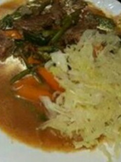 A picture of Stewed beef with Steamed Cabbage.