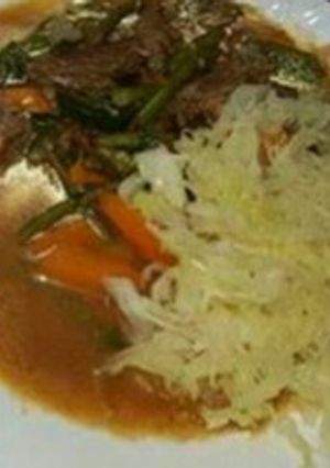 A picture of Stewed beef with Steamed Cabbage.