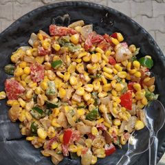 A picture of Cheesy corn salad.