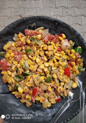 A picture of Cheesy corn salad.