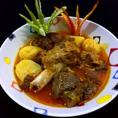 A picture of Alu ghosht.