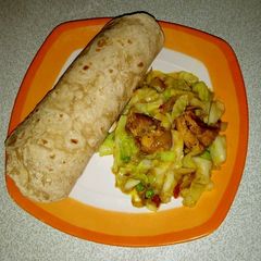 A picture of Indian roti with cabbage stir fry.