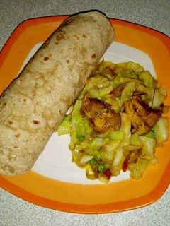 A picture of Indian roti with cabbage stir fry.