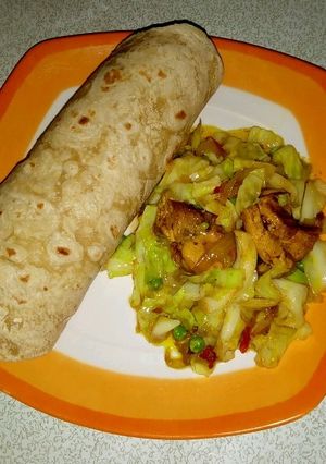 A picture of Indian roti with cabbage stir fry.