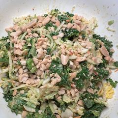 A picture of Kale salad with crushed peanuts.