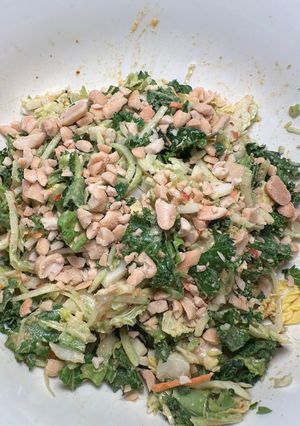 A picture of Kale salad with crushed peanuts.