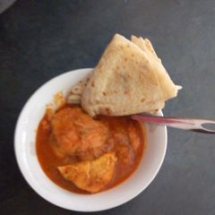 A picture of Butter Chicken and Roti.