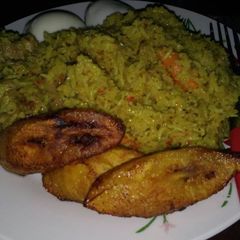 A picture of Fried rice with fried plantain.