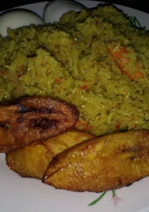 A picture of Fried rice with fried plantain.