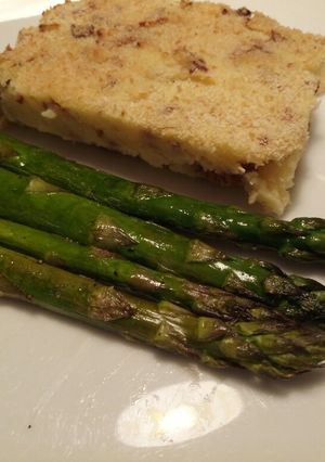 A picture of Potato pie, with pancetta & chanterelle mushrooms & asparagus.