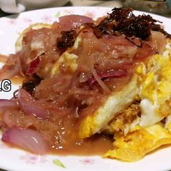 A picture of Fried Eggs With Onion In Sweet Tamarind Sauce.