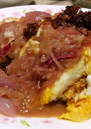 A picture of Fried Eggs With Onion In Sweet Tamarind Sauce.