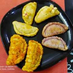 A picture of Different types of mawa gujiyas.