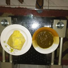 A picture of Black soup and eba.