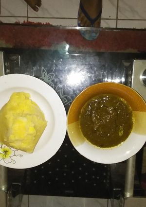 A picture of Black soup and eba.