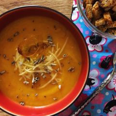 A picture of Smoked pumpkin soup with cheddar.