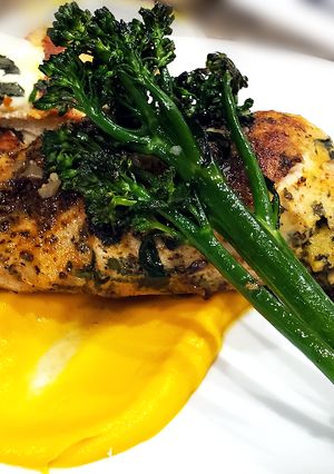 A picture of Sous Vide Stuffed Chicken Breast w/ Carrot Puree.