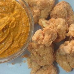 A picture of Chicken fried cauliflower with vegetable sauce.