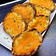 A picture of Crispy Cheese & Ham Loaded Potato Boats.