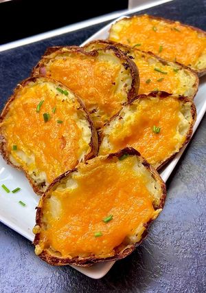 A picture of Crispy Cheese & Ham Loaded Potato Boats.