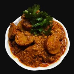 A picture of Sweet potatoes with curd gravy.