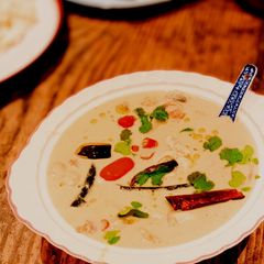 A picture of Chicken in coconut soup with galangal and chillies (Tom Kha Gai).