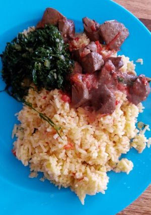 A picture of Fried rice with liver and greens.