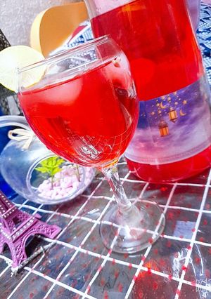 A picture of Red Sharbat with Lemon.