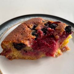 A picture of Raspberry and blueberry cornmeal cake.