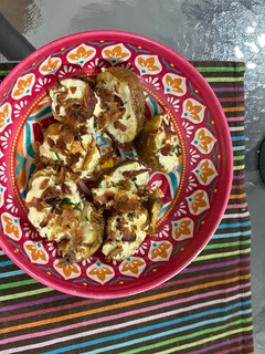 Una foto de Papas con sour cream